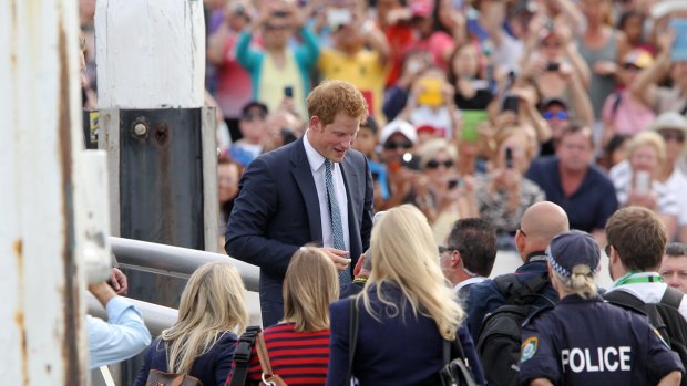 He's history: Prince Harry greets the crowd at Campbell's Cove, Sydney, during his 2013 visit.