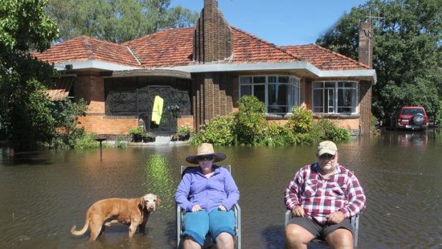 Don Kerry and his daughter Nikki pass the time in the front yard of his home in Numurkah.