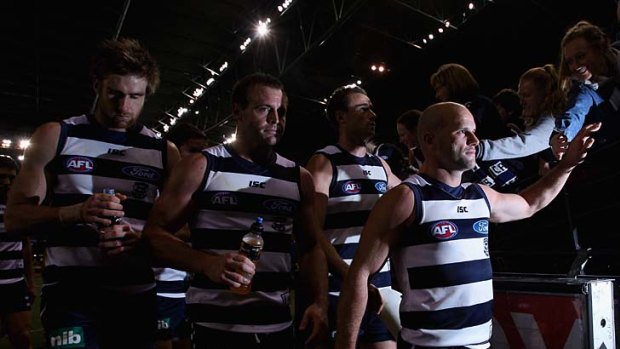 Geelong players celebrate after their round 18 victory over Richmond.