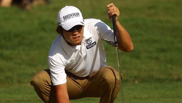 Kyung-Tae Kim ... leads by one shot.