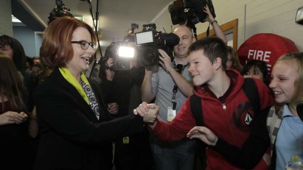 Prime Minister Julia Gillard visits Lyneham High School in Canberra on Thursday.