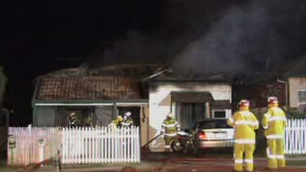 Firefighters battle the house fire in Victoria Park.