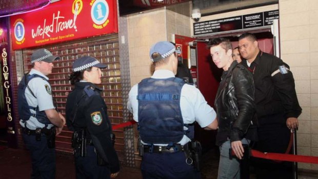 Nightlife beat ... NSW Police patrol the Kings Cross strip, but club bouncers do the heavy lifting.