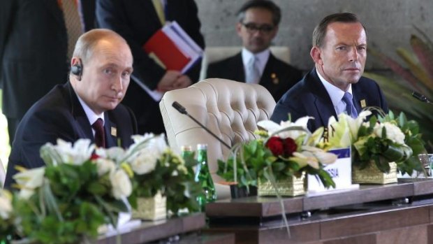 Vladimir Putin and Prime Minister Tony Abbott during the APEC Economic Leaders Meeting.