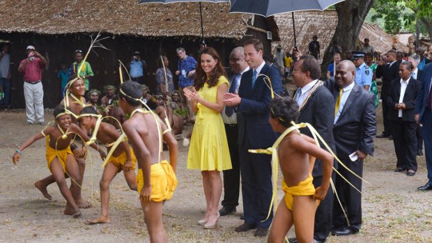 Model citizen ... the Duke and Duchess of Cambridge watch traditional dancers during a visit to a cultural village in Honiara.