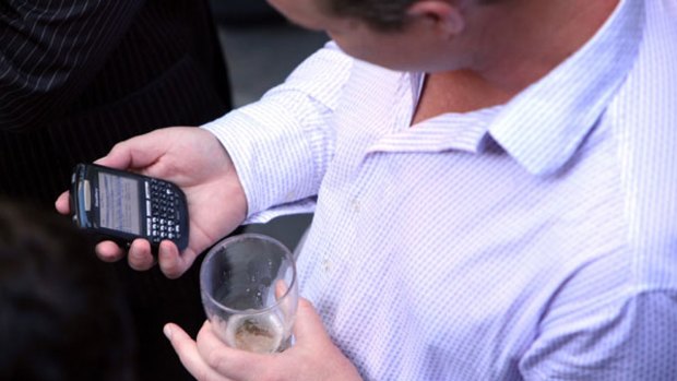 Checking emails while at the pub with friends is a habit of many BlackBerry users.