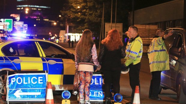 Police at Manchester Arena after reports of an explosion.