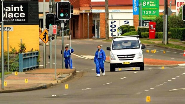 Looking for evidence: police search the scene in Cessnock.