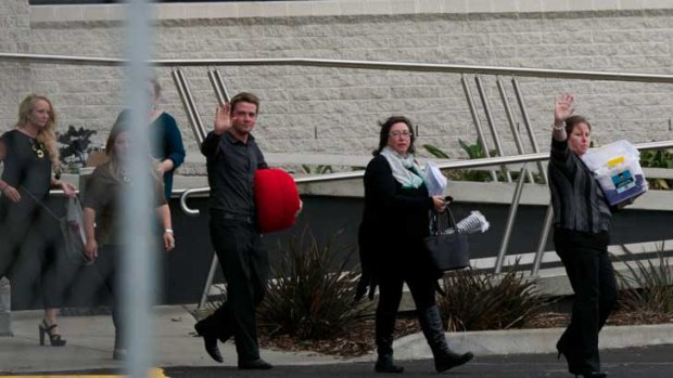 Sacked Target staff leave the company's Geelong headquarters.