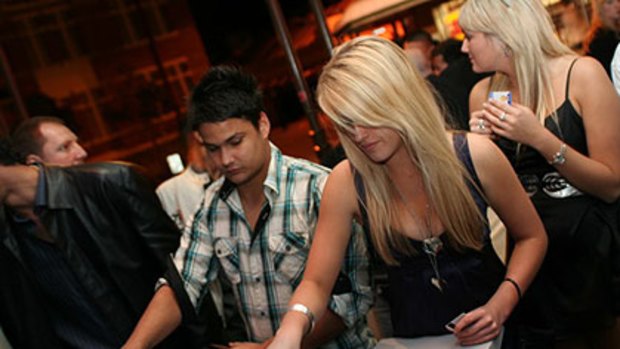 Patrons scan their fingerprints during a recent trial of the NightKey system at the Metropolis Fremantle nighclub.