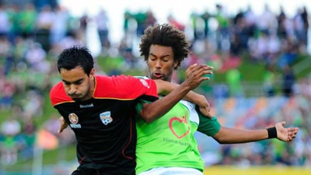 Isaka Cernak of the Fury contests the ball with Marcos Flores of Adelaide.