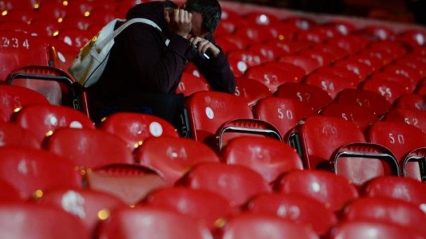 Tears in the stand: A Liverpool fan is disbelief after Crystal Palace's comeback.