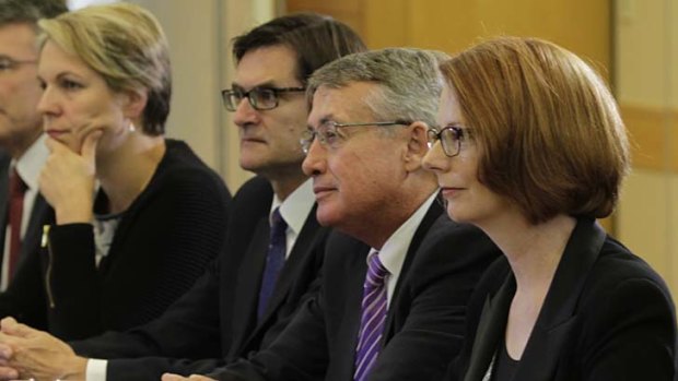 Julia Gillard with members of the cabinet in Blacktown earlier this month. A major ministerial reshuffle is now planned.