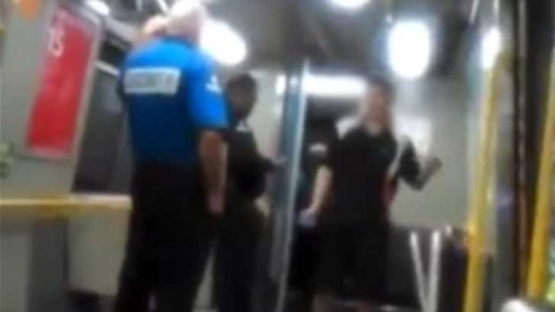 A young man engaged in racial abuse after a train guard told him to take his feet of the seat.