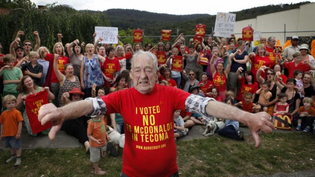 Get the message? Protesters spearheaded by the oldest Tecoma resident, 84-year-old Robert Maxwell, take a stand against McDonald's.