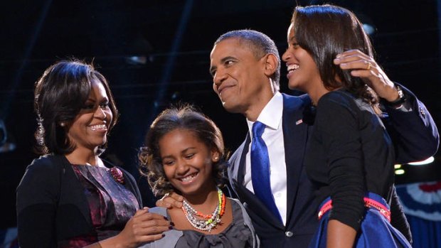 Michelle and Barack Obama with their daughters on his re-election as president last year.