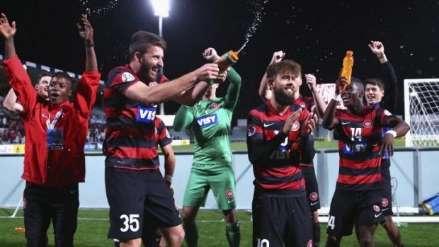Winners are grinners: The Wanderers celebrate their win over FC Seoul.