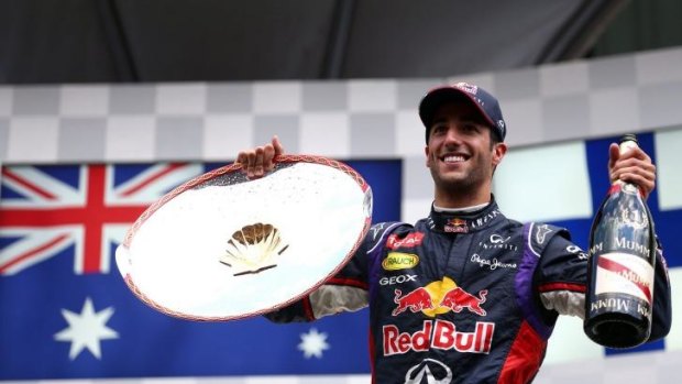 Dan's the man: Daniel Ricciardo celebrates victory at the Belgium Grand Prix.