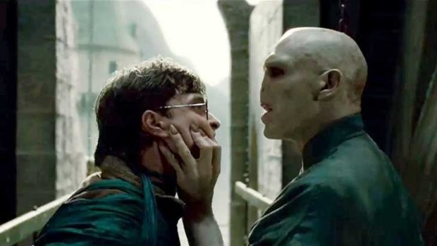 Daniel Radcliffe as Harry Potter and Ralph Fiennes as Lord Voldemort in the final showdown.