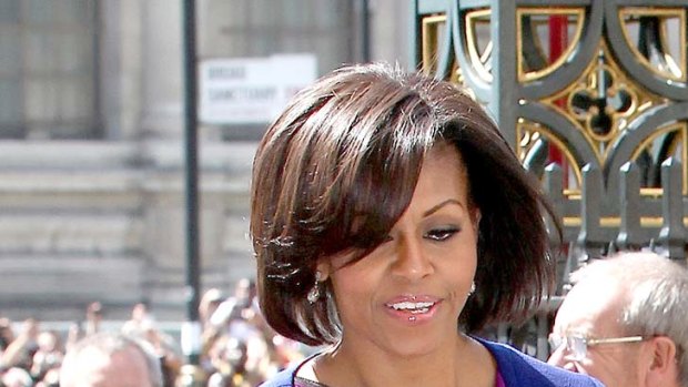 Michelle Obama finesses colour toning ... neutral navy offsets fuchsia.