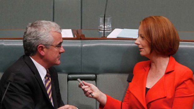 Courtship ... Prime Minister Julia Gillard talks with Independent MP Andrew Wilkie.