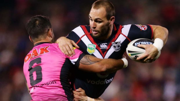 Bad day at the office: Simon Mannering of the Warriors is tackled.