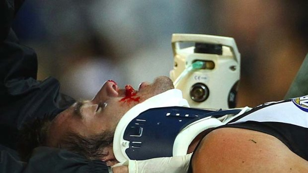 Alan Toovey is taken from the ground with an injury during the round eight match between Geelong and Collingwood.