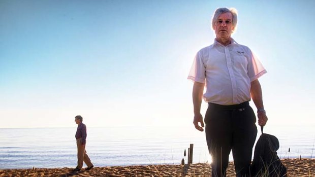 Mornington Peninsula councillor Leigh Eustace, sporting a "giveaway" backpack, at the site of a proposed fence designed to stop lewd behaviour at a popular nudist beach.