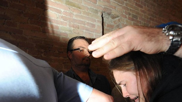 Dramatic scenes ... A sobbing Amanda Knox is ushered from the court ahead of her release.