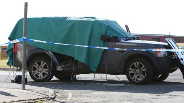 A vehicle is seen on a street in Seascale after taxi driver Derrick Bird went on a shooting rampage.