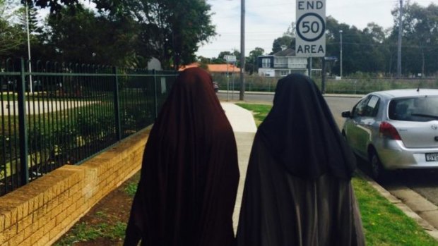 The sisters of terrorism accused Omarjan Azari in Guildford. 