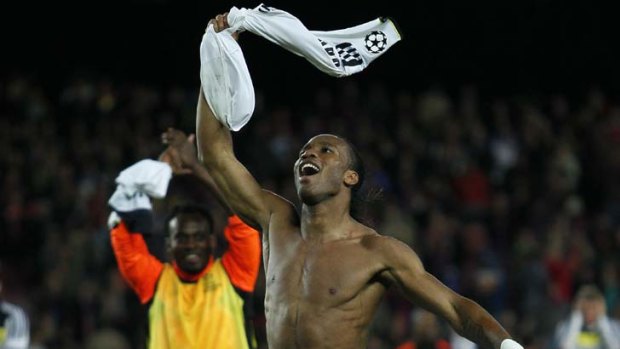 Bound for Munich ... Didier Droga celebrates after the stunning result at Camp Nou.