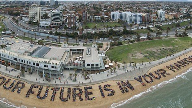 In a well-planned and choreographed protest, thousands of people turn out at St Kilda beach to say their piece.