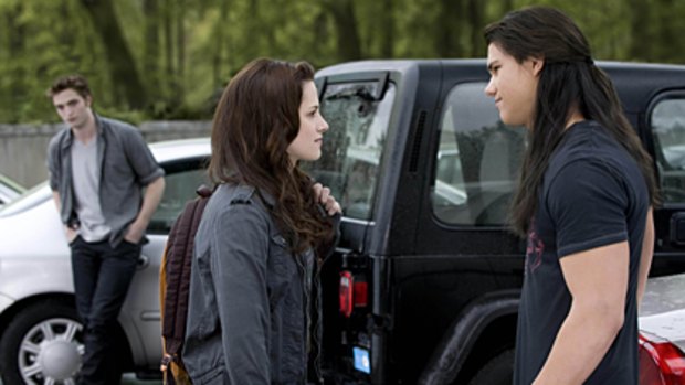 In a scene from Twilight: New Moon are (from left) Robert Pattinson (as Edward Cullen), Kristen Stewart (Bella Swan) and Taylor Lautner (Jacob Black).