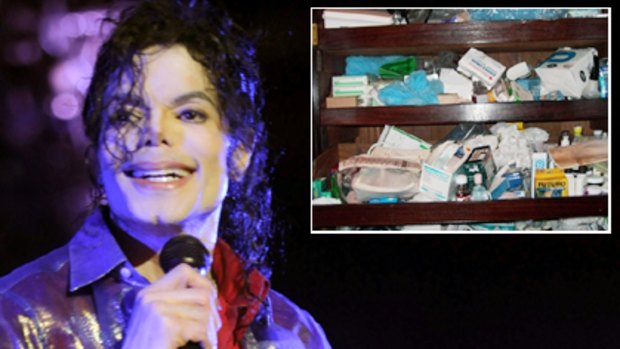 Michael Jackson in rehearsal mode last month, inset, a picture from a police raid at Neverland in 2003 showing drugs found on the premises.