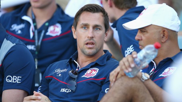 Onlooker: Suspended Roosters player Mitchell Pearce watches from the  stand during the round one NRL match against the South Sydney Rabbitohs at Allianz Stadium.
