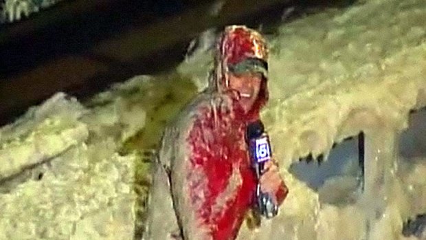 Call of duty ... Local reporter Tucker Barnes continues his weather update despite being hit with waves of sewage.
