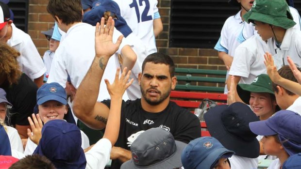King of the kids &#8230; Greg Inglis was the star of the show at Erskineville Oval yesterday. Inglis was injured earlier this month playing for the indigenous All Stars.