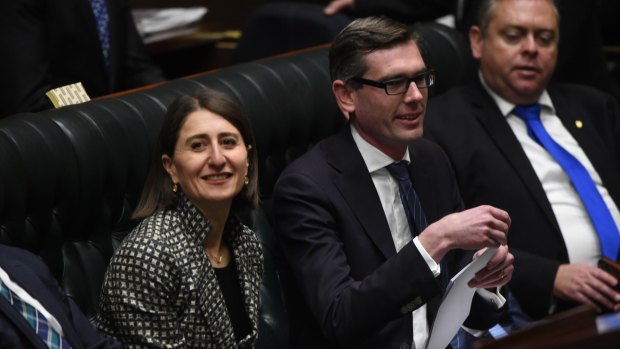 Gladys Berejiklian flanks Treasurer Dominic Perrottet as he delivers his first NSW budget.