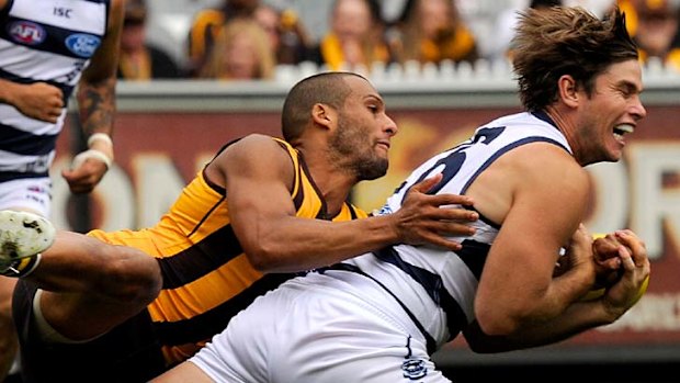 Patience rewarded ... Geelong's Tom Hawkins marks against the Hawks.