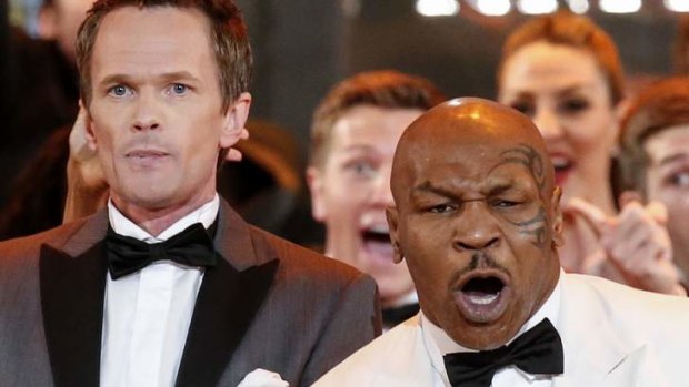 Host Neil Patrick Harris and retired boxer Mike Tyson perform during the opening number of American Theatre Wing's annual Tony Awards.