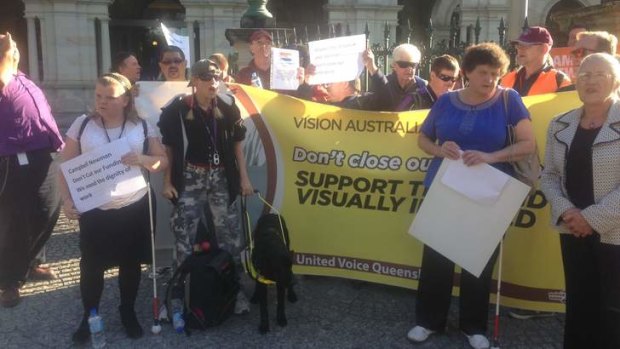 Shelley Heaton (camouflaged pants) protests the Vision Australia job cuts.