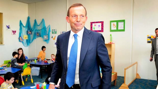 Firing line: Tony Abbott at an autism centre on Tuesday.