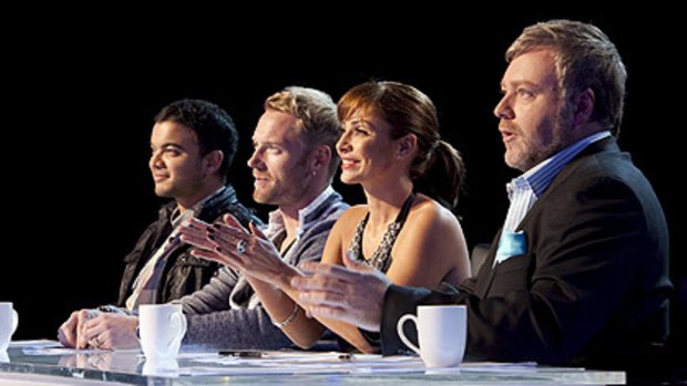 Missing in action ...Kyle Sandilands, right, on the X Factor panel.