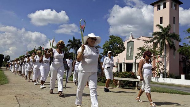 Members of dissident group The Ladies in White march during their weekly protest in Havana.