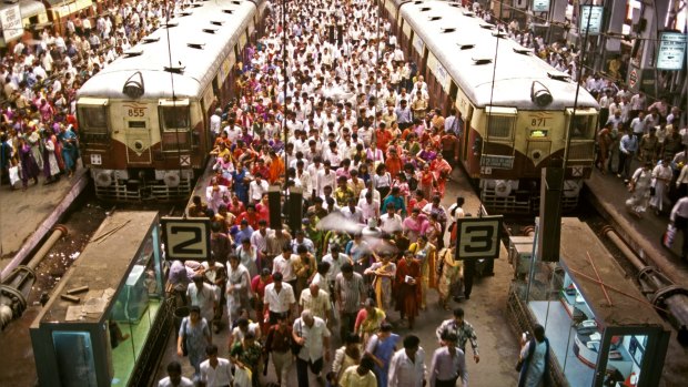 Rush hour commuters at busy Churchgate terminus on a normal day in Mumbai.
