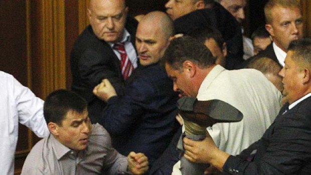 Political fight ... a scuffle broke out during a session in the chamber of the Ukrainian parliament.