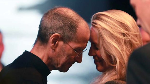 Steve Jobs leans his forehead against his wife, Laurene Powell Jobs, after delivering the keynote address to the Apple Worldwide Developers Conference in June.