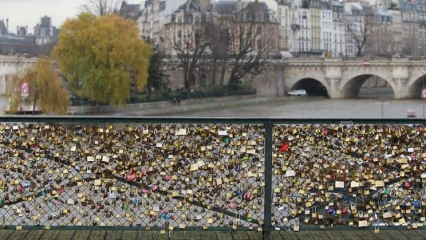 Part of the famous footbridge's railing has collapsed under the weight of the collected love tokens.