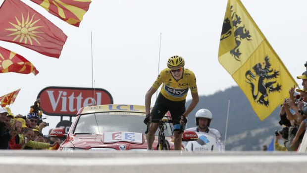 On the precipice: Team Sky's Chris Froome crosses the line to win stage 15 on Sunday and extend his overall lead.